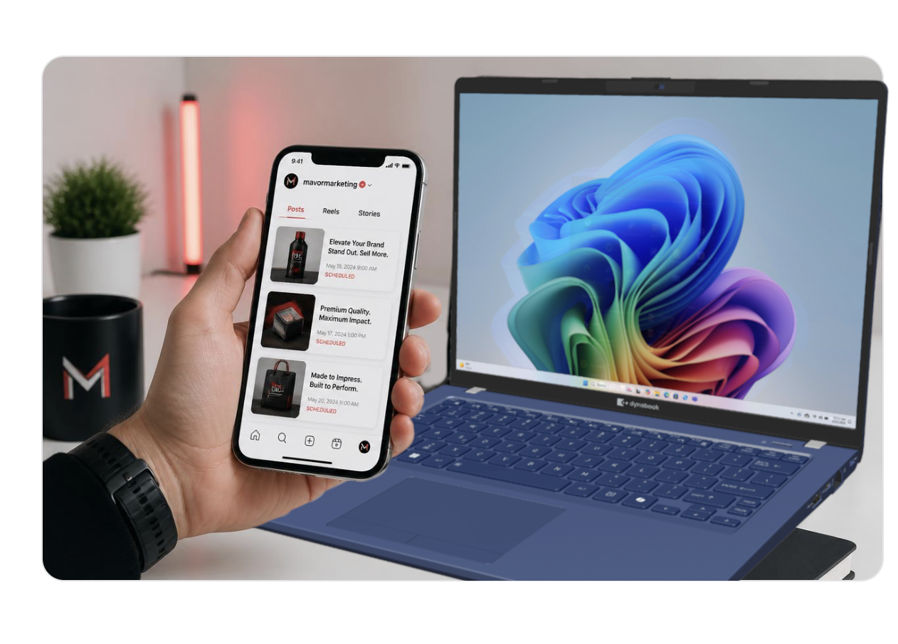 Hand holding a phone with scheduled social posts next to a dynabook laptop